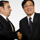 Ghosn, left, and Mitsubishi Motors Corp. Chairman and CEO Osamu Masuko, right, when they made their 2016 deal. AP Photo.